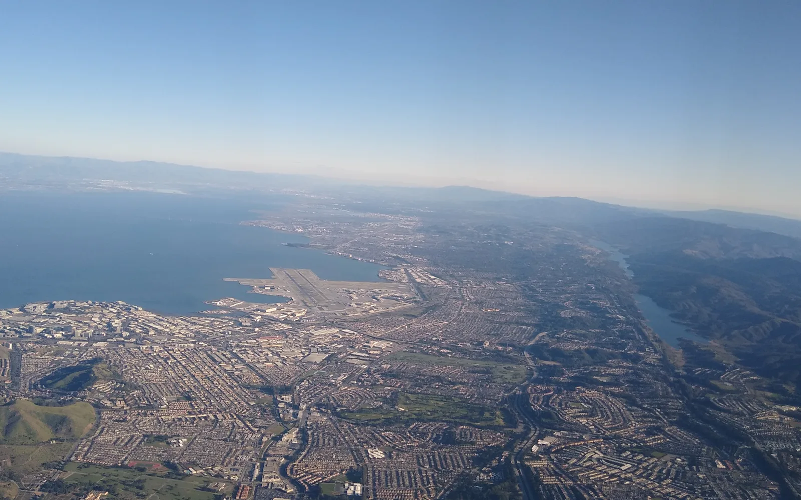 An aerial view of South San Francisco and San Francisco International Airport, showing the city's layout and proximity to the airport